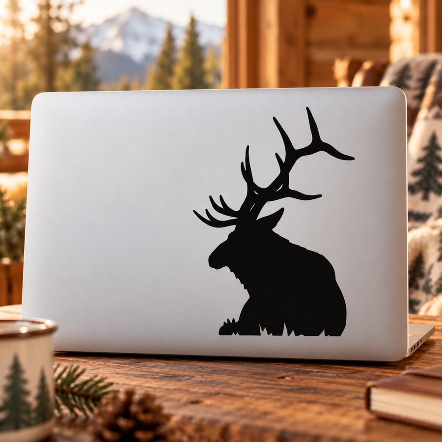 Black bull elk sitting on grass silhouette decal