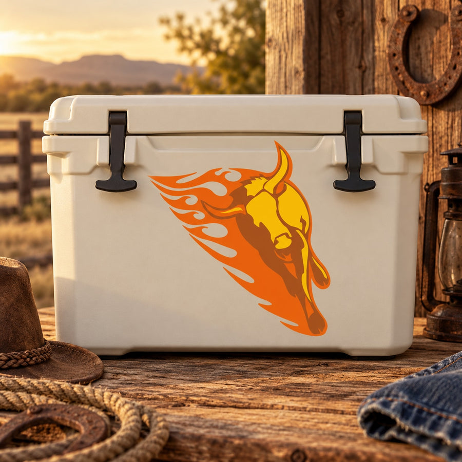 Flaming bull head sticker with orange and yellow flames on a white cooler