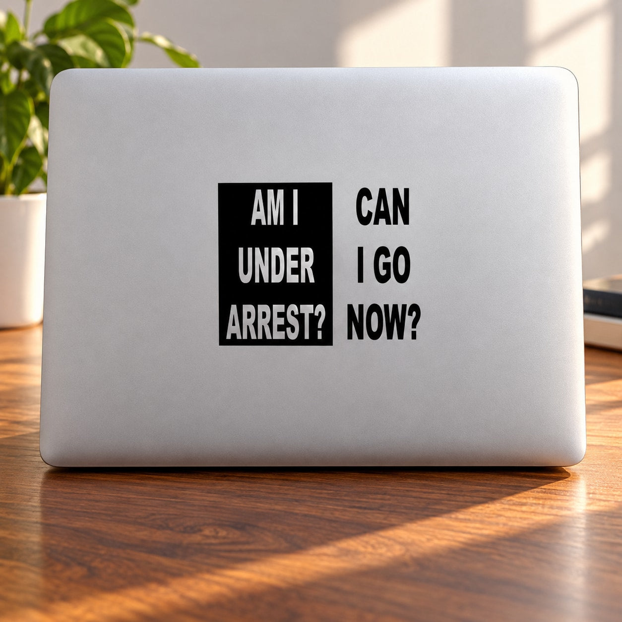 Black text vinyl decal: “AM I UNDER ARREST? CAN I GO NOW?”