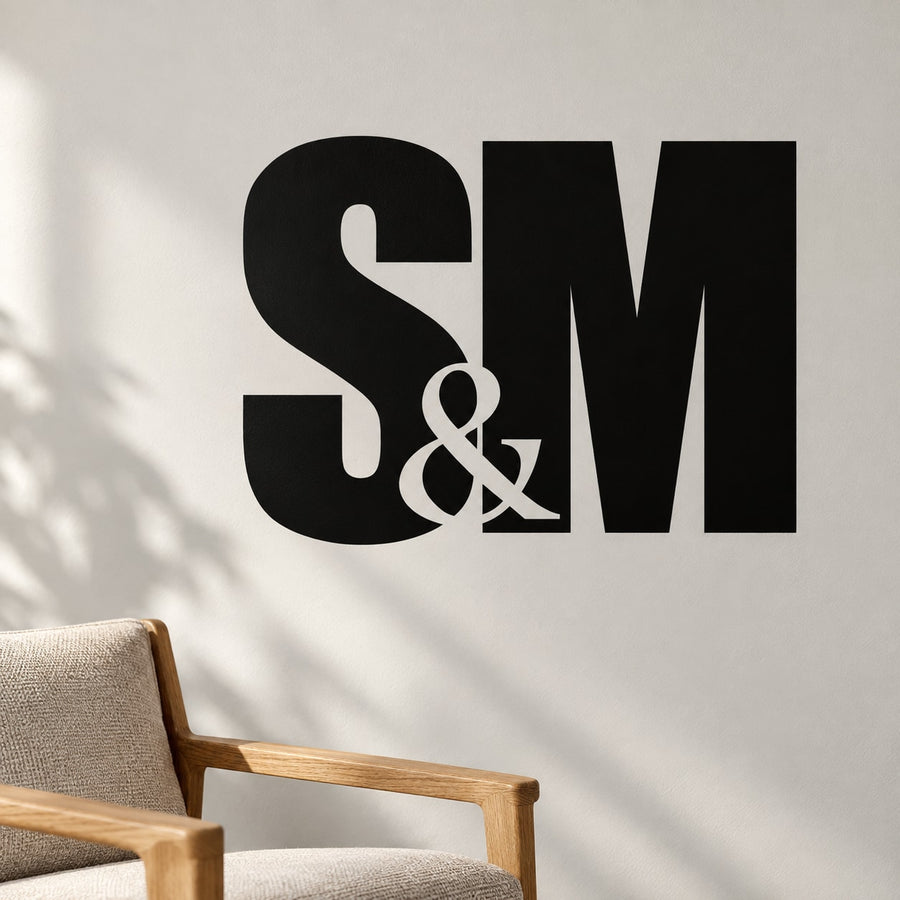 Black wall decal with large "S & M" lettering