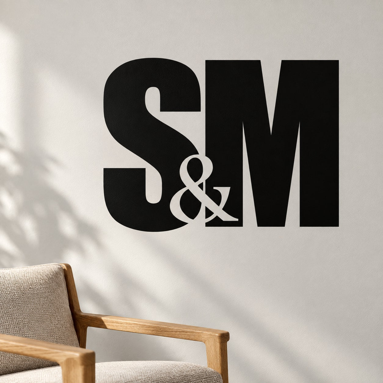 Black wall decal with large "S & M" lettering