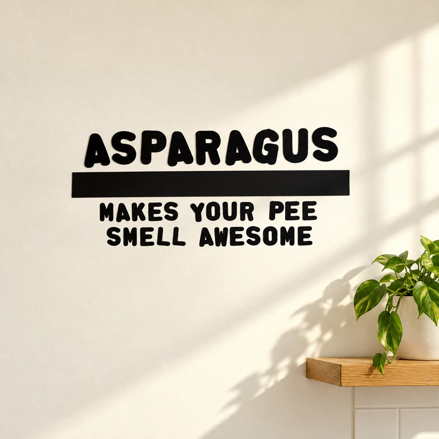 Asparagus quote wall decal, bold black text: 'ASPARAGUS' and 'MAKES YOUR PEE SMELL AWESOME'.