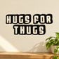 Hugs for thugs vinyl decal with bold black and cream lettering, stacked design