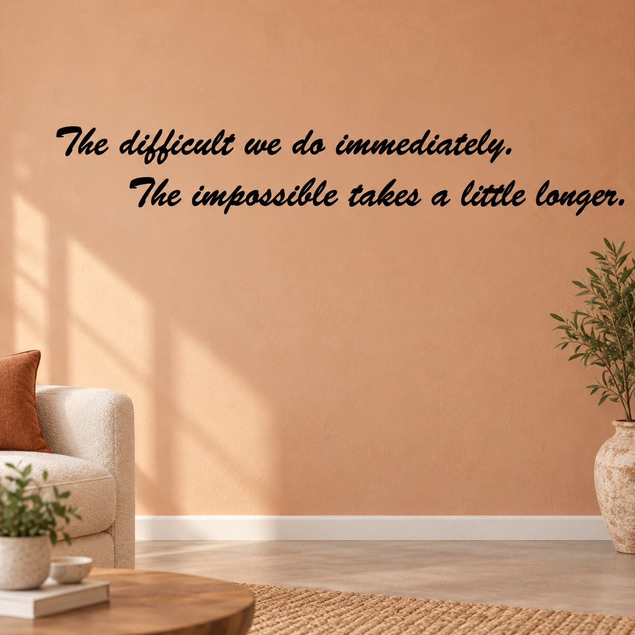 The difficult We Do Immediately The Impossible takes a little longer Wall Decal — illustrative vinyl decal application mockup. Surrounding objects are not included.