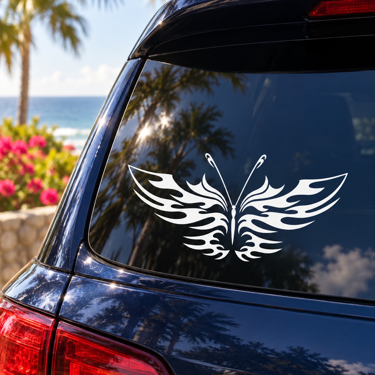 White butterfly wing vinyl decal on dark car window