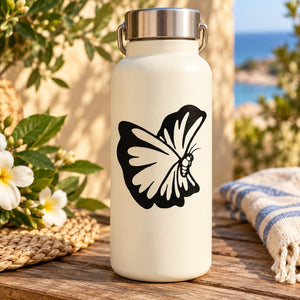 Water bottle with black butterfly wing heart decal on cream surface