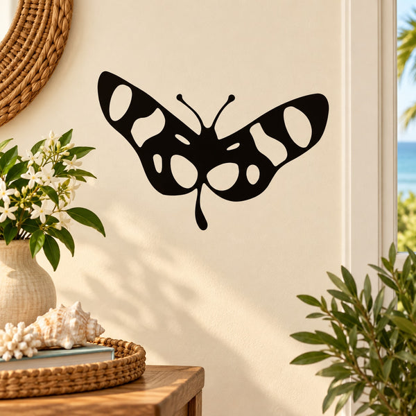 Spotted wing butterfly decal: black butterfly with white spots and antennae.