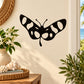 Spotted wing butterfly decal: black butterfly with white spots and antennae.