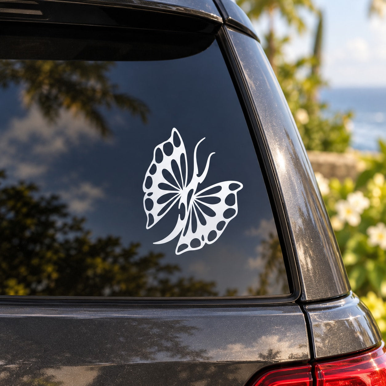 White tribal butterfly body decal on car rear window