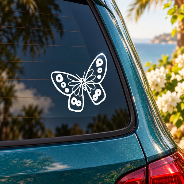 Butterfly flight decal with dotted wing outline on car window