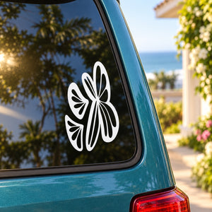 Set of three abstract butterfly decals with white butterfly shapes on a car window