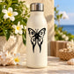 Cream reusable water bottle with black tribal butterfly decal and metallic silver cap