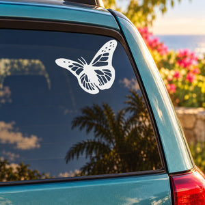 White butterfly vinyl decal on car window glass