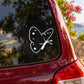 White butterfly vinyl decal on red car window glass