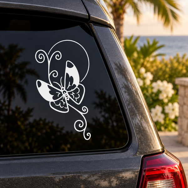 Butterfly vinyl car decal with white swirl-wing design on dark window