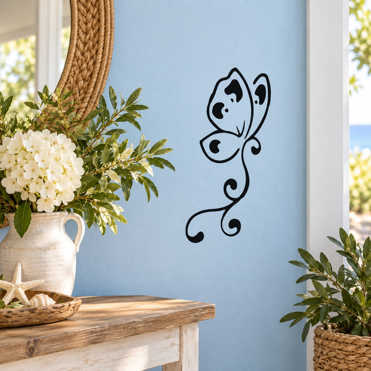 Butterfly wall vinyl decal with black outline on light blue background