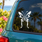 White butterfly vinyl decal on car window, decorative wings and antenna