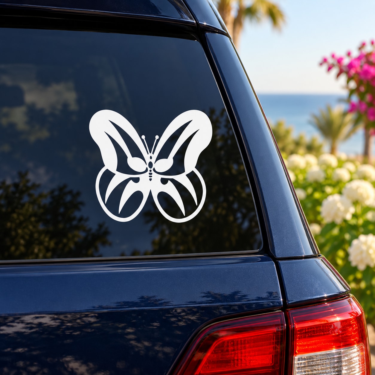 White butterfly vinyl decal on a car window with symmetrical bowlike wings