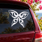 Butterfly vinyl decal with white stylized wings on a car window