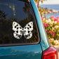 White butterfly vinyl decal on car window glass