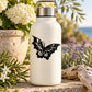Vinyl butterfly decal: black butterfly graphic on a white bottle