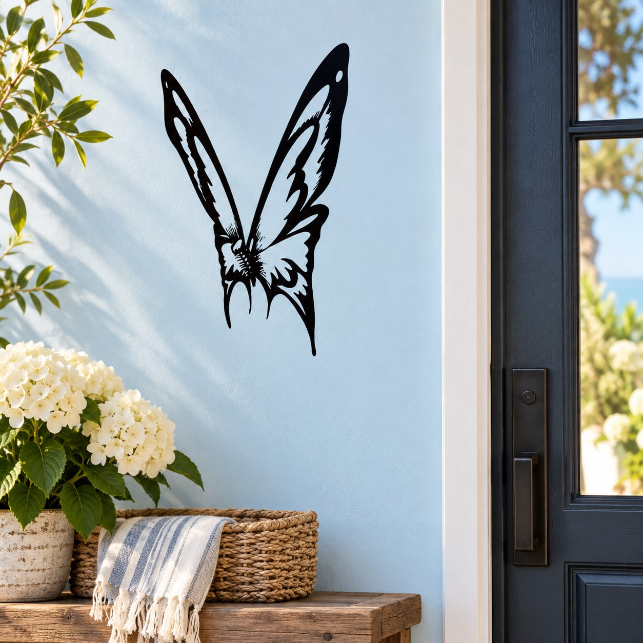 Black butterfly wall vinyl decal on light wall near window