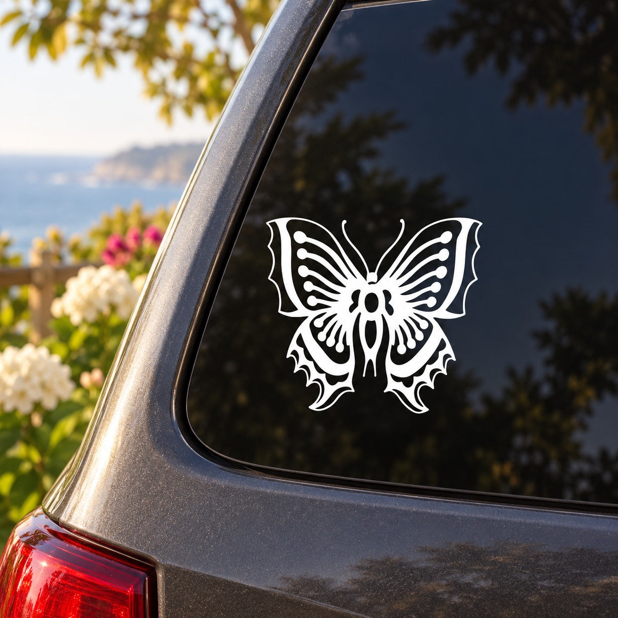 Butterfly vinyl decal: white outlined design on car window