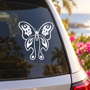 White butterfly vinyl decal on a car window glass