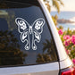 White butterfly vinyl decal on a car window glass