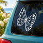 Butterfly vinyl decal in white with dotted wing pattern on car window