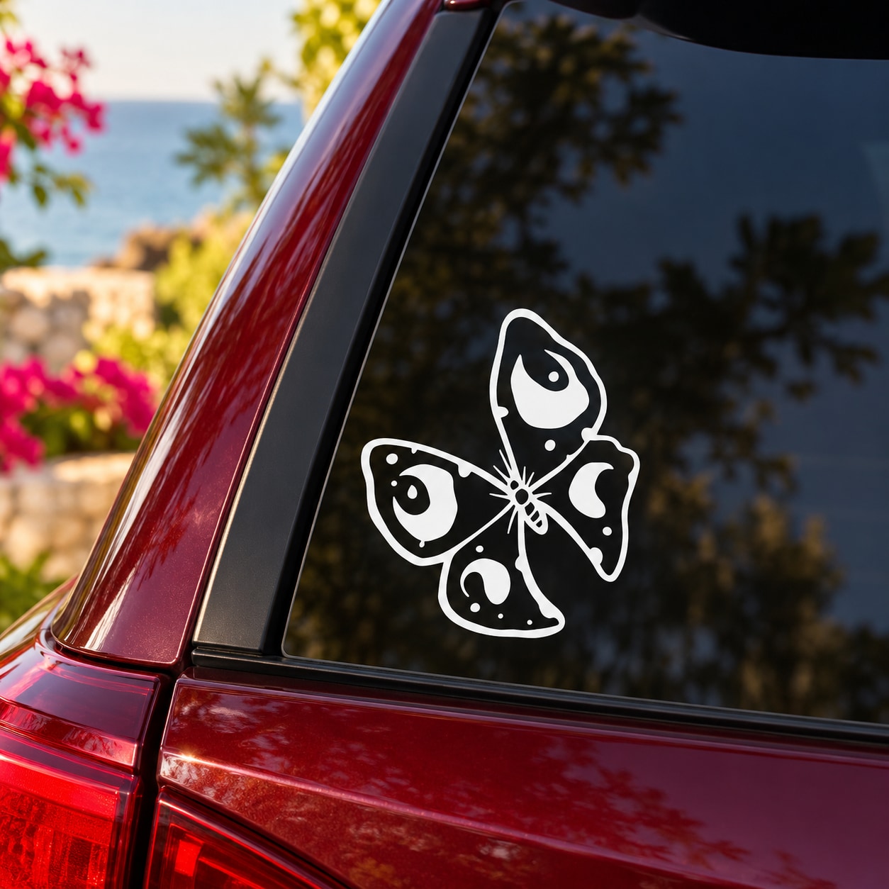 Butterfly vinyl decal, white outline butterfly on dark car window