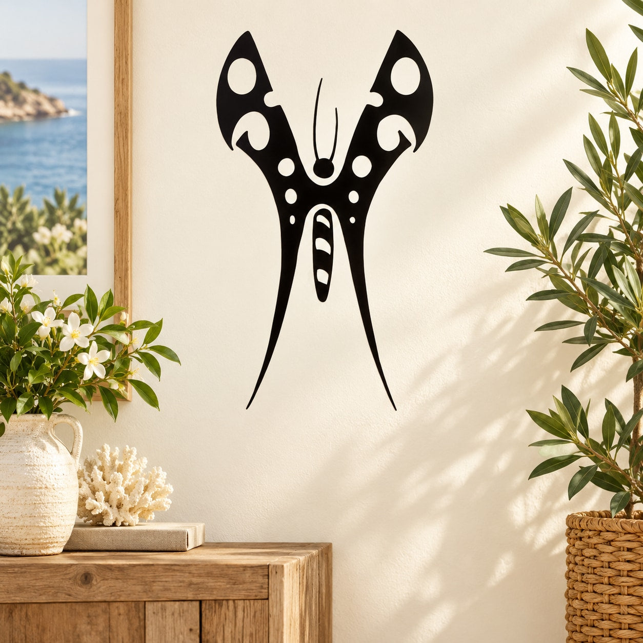 Black butterfly vinyl wall decal with symmetrical wings and body.