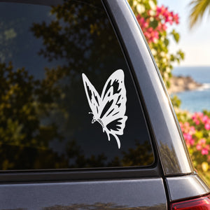 White butterfly vinyl decal on car window glass