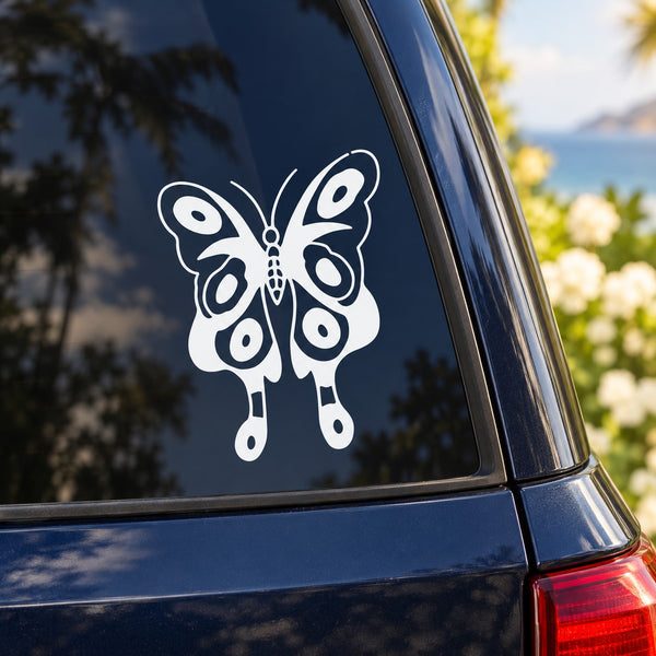 White butterfly vinyl decal on blue car window glass