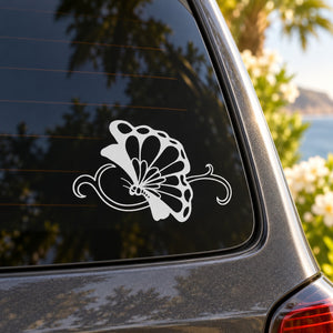 Butterfly vinyl decal with white outlined wings and swirls on car window