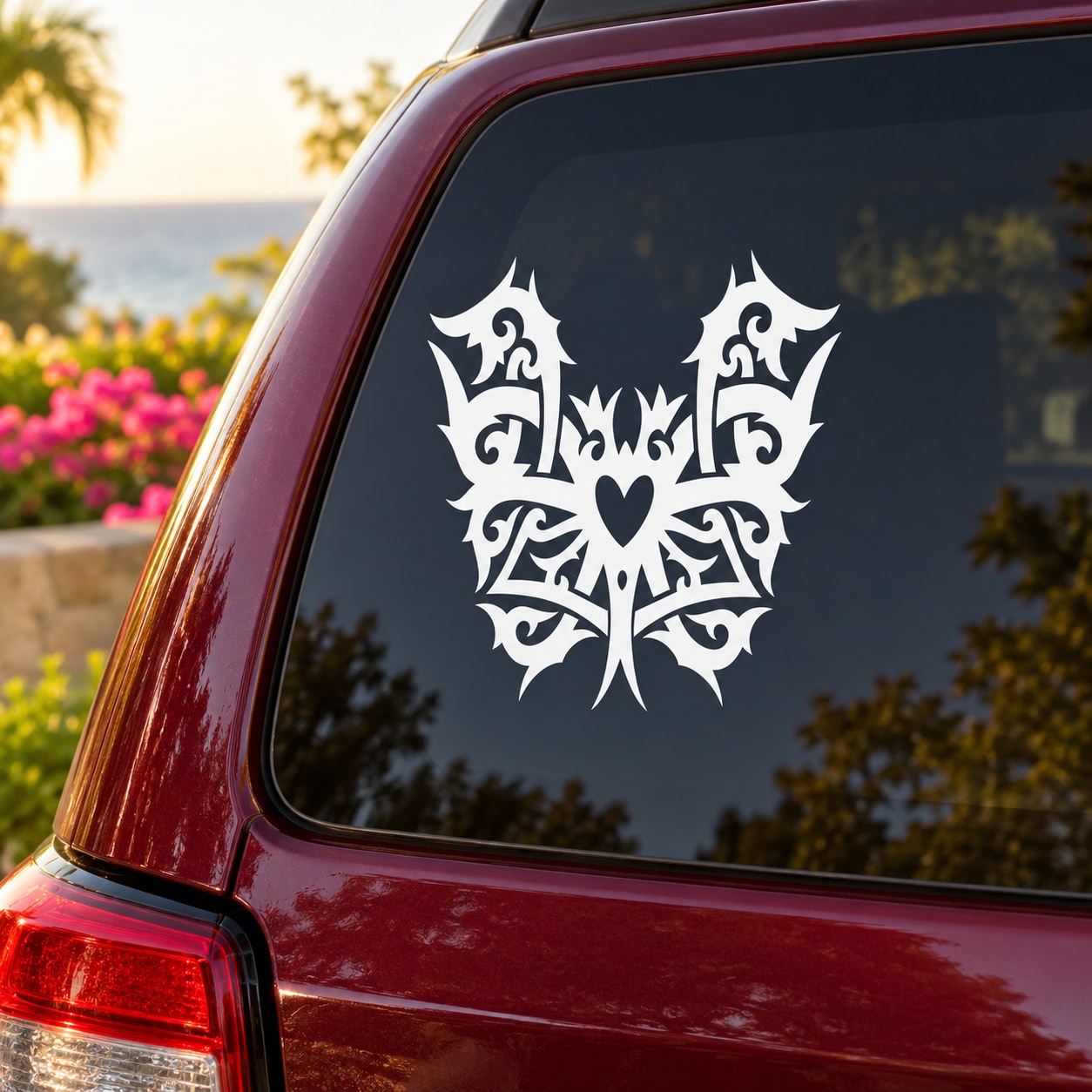White butterfly vinyl decal with ornate wings and heart center for car window