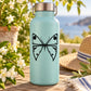 Butterfly vinyl decal with symmetrical bow design on light blue surface