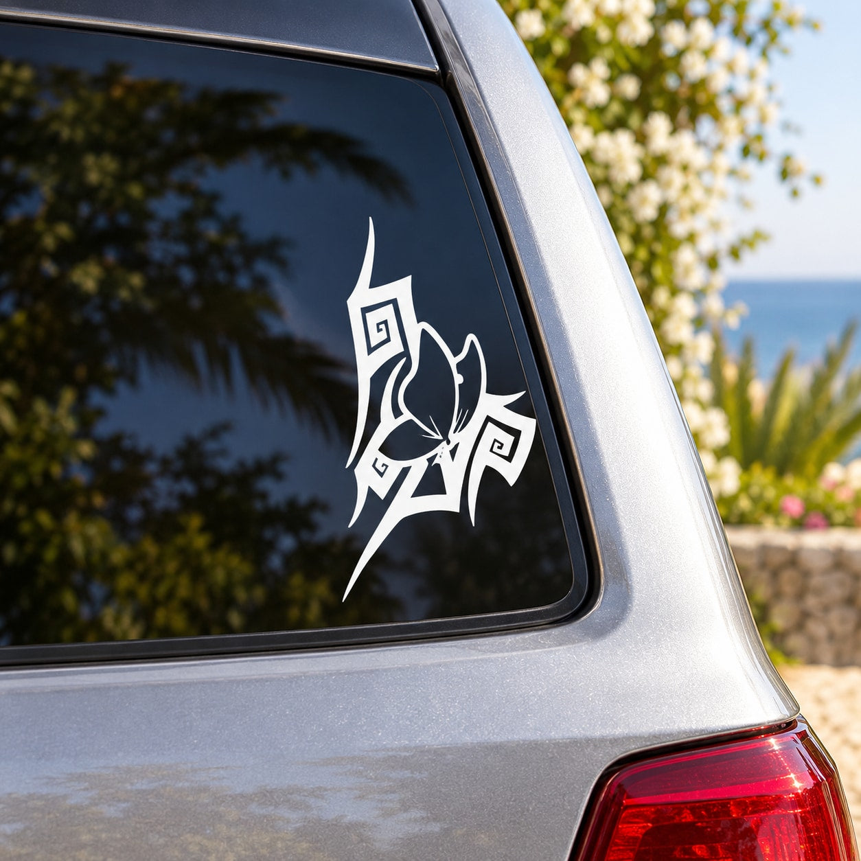 Butterfly vinyl car decal with outlined wing design on window