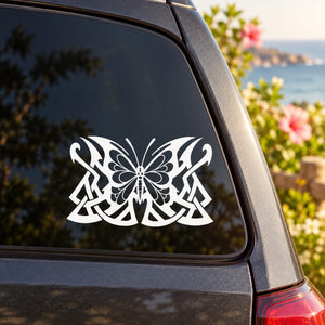White vinyl butterfly wall decal with ornate mandala wings on car window