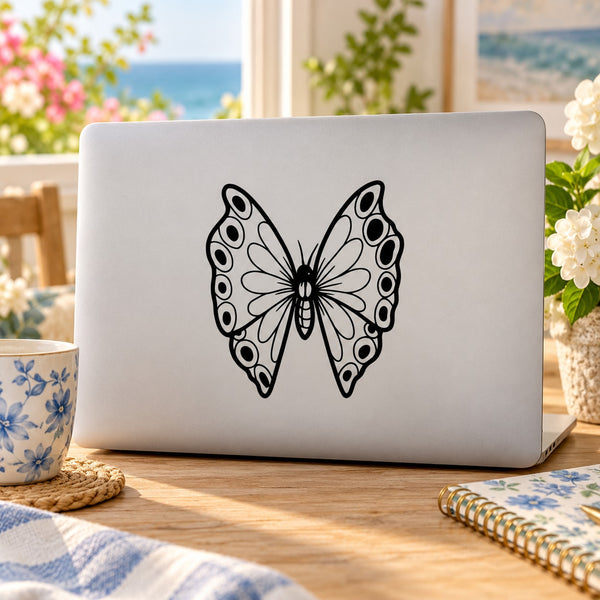 Black butterfly vinyl decal with symmetrical wings and dot patterns