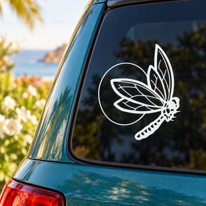 Butterfly vinyl decal with white outline on a car window