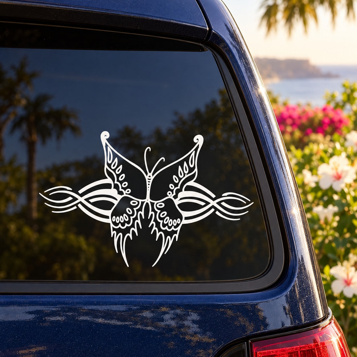 Butterfly vinyl decal with intricate wing lines, white, on a car window