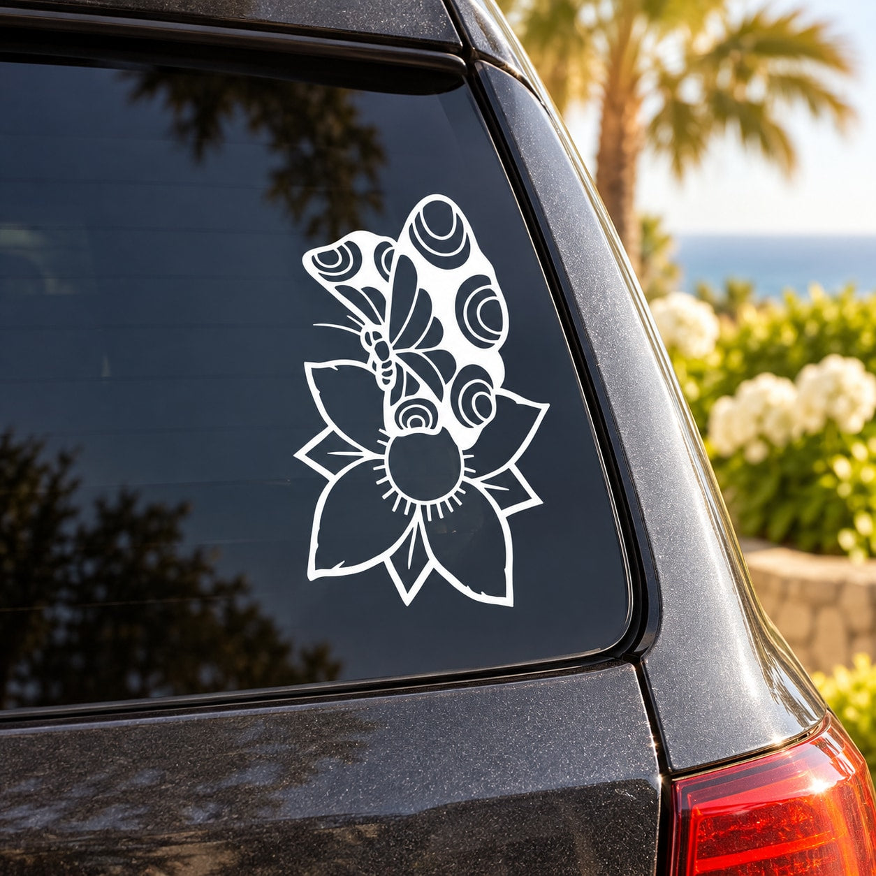 White butterfly vinyl decal with ornate wings and floral accents for car window