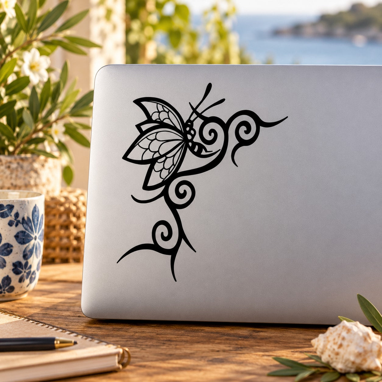 Butterfly vinyl wall decal: black ornamental butterfly with curls and antenna