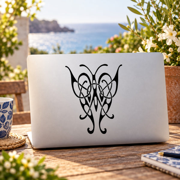 Black butterfly vinyl wall decal with ornate heart-like center design