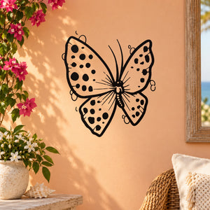 Butterfly vinyl wall decal with black dotted wings and curled antennae