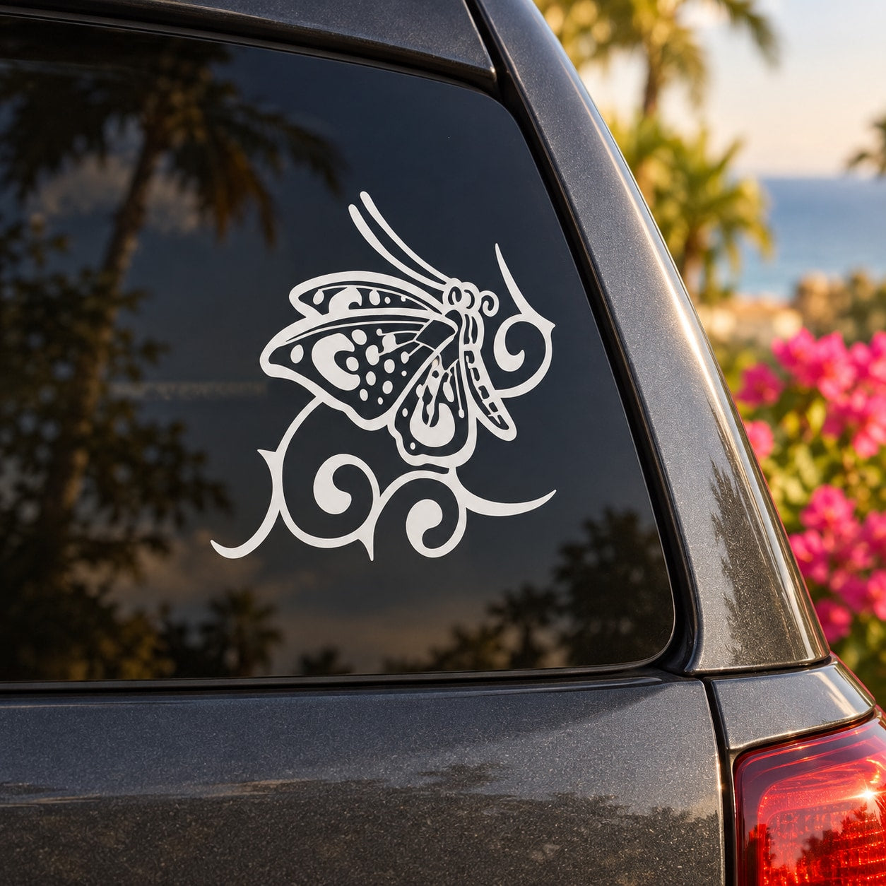White butterfly vinyl decal with decorative swirl details for car window