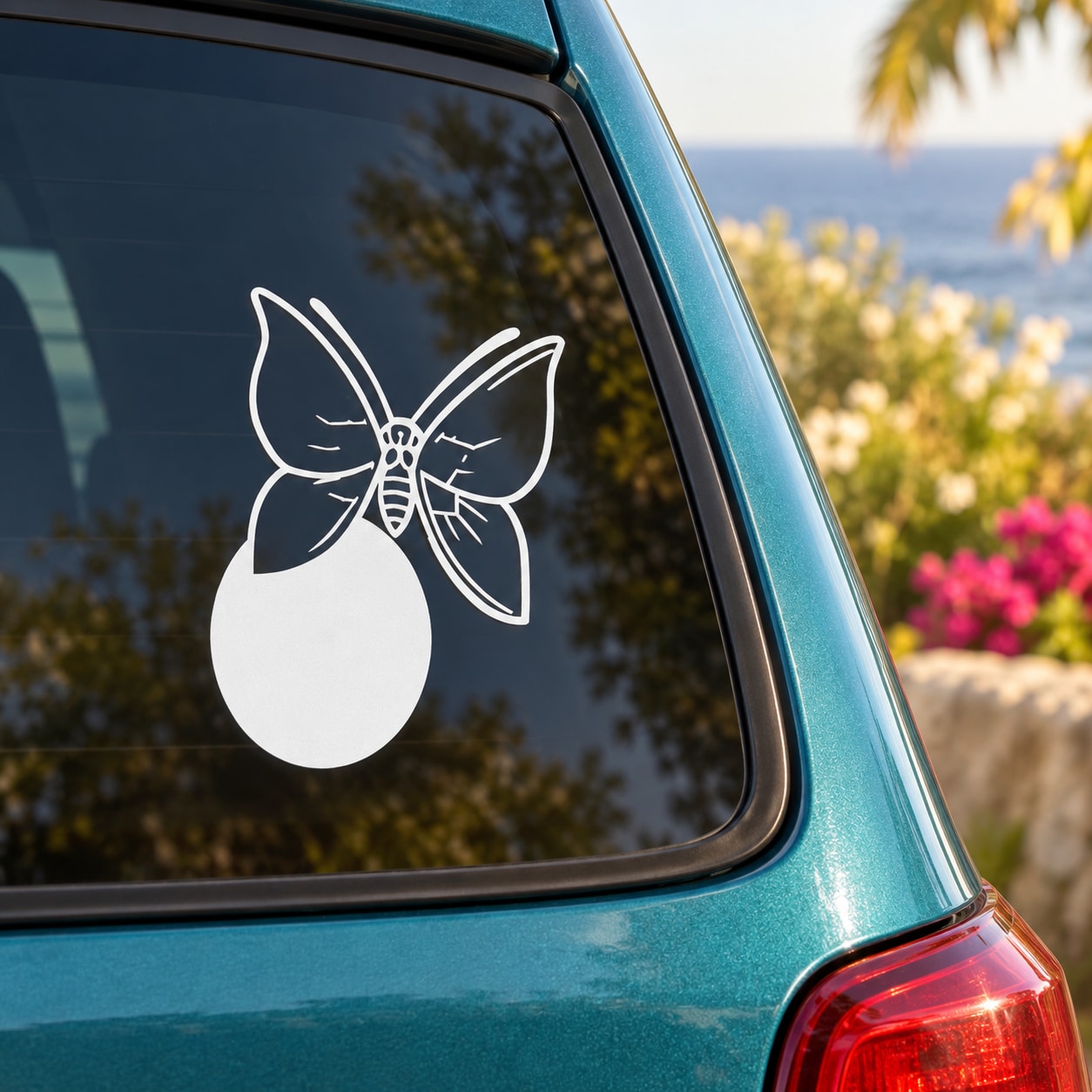 White butterfly vinyl decal with outlined wings and drop-shaped body on car window