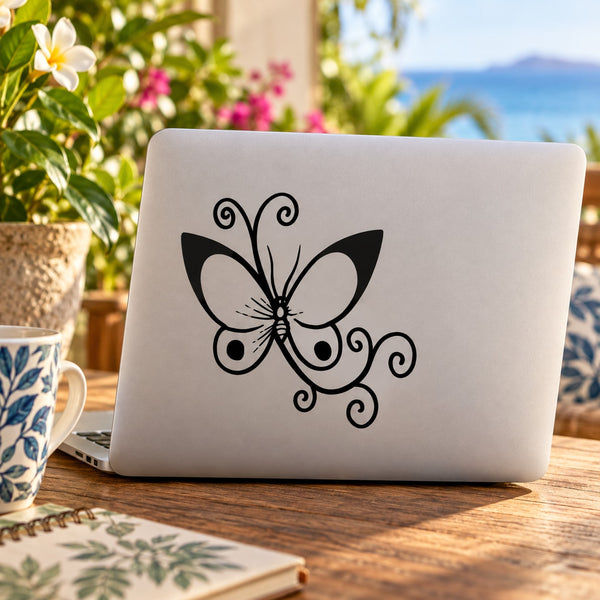 Black butterfly vinyl decal with scrolling antenna wings on smooth surface