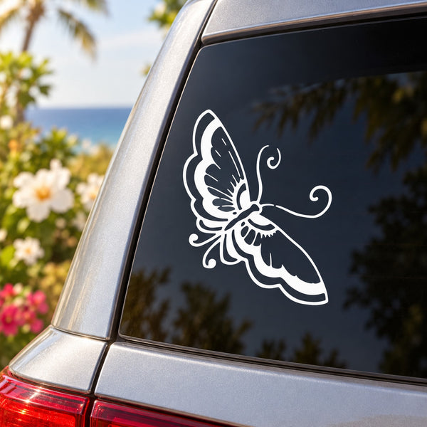 Butterfly vinyl decal in white outline on a dark car window
